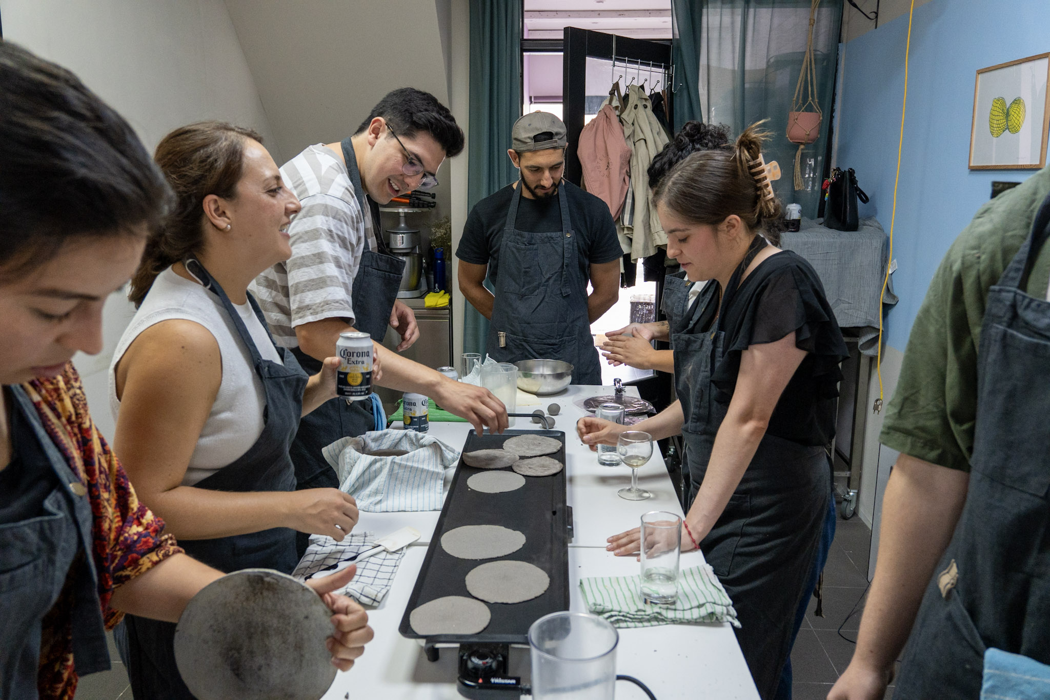 Guests making tortillas together at a Chilango Eats session